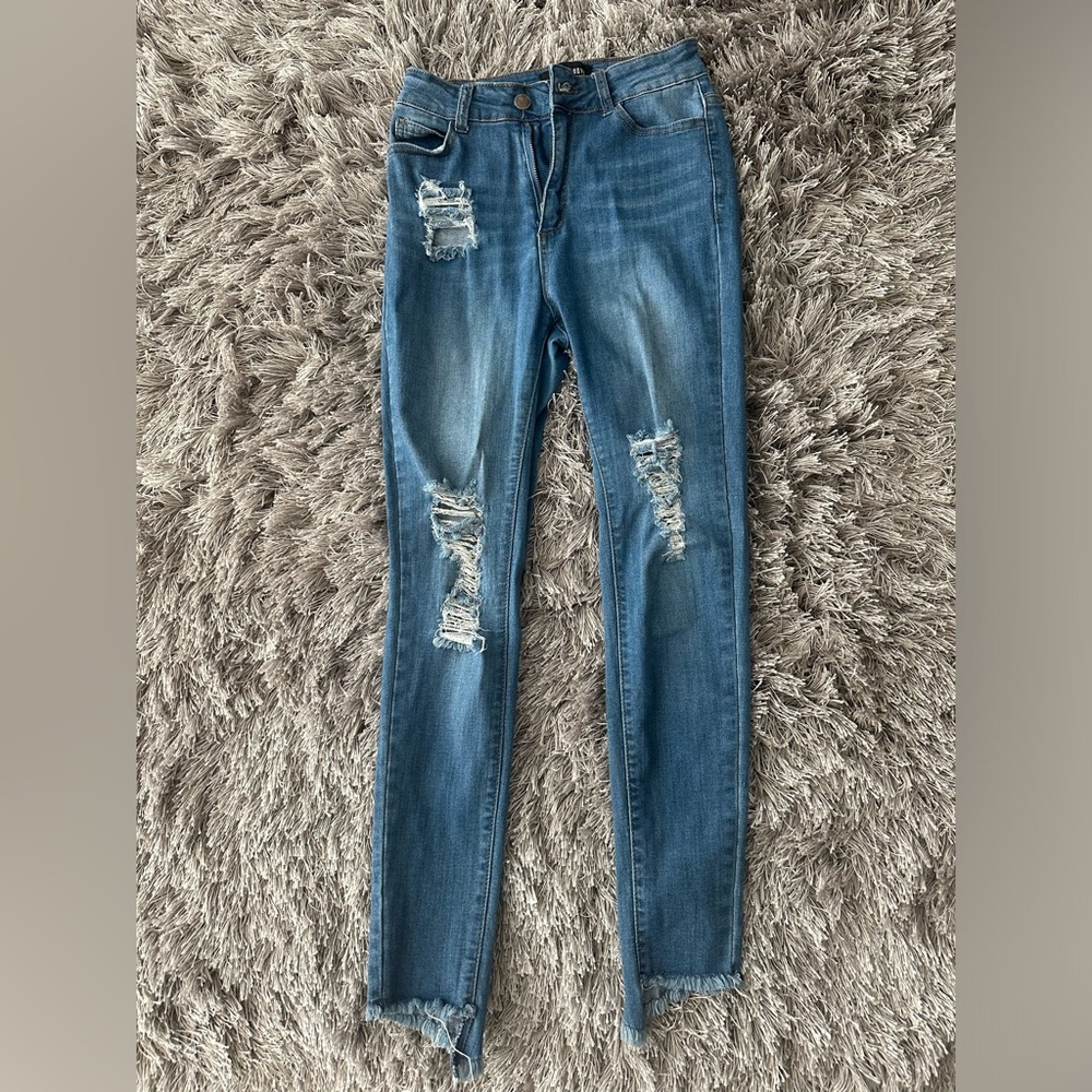 Distressed blue jeans